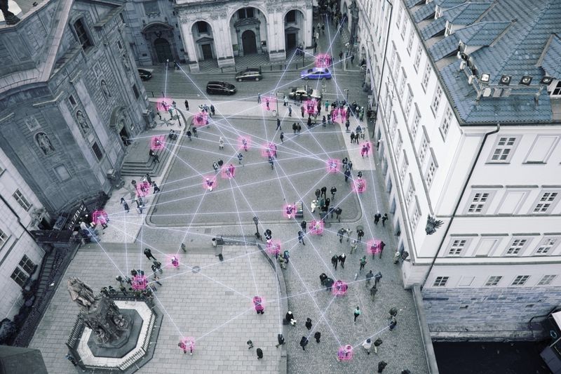 People in street connected by blockchain