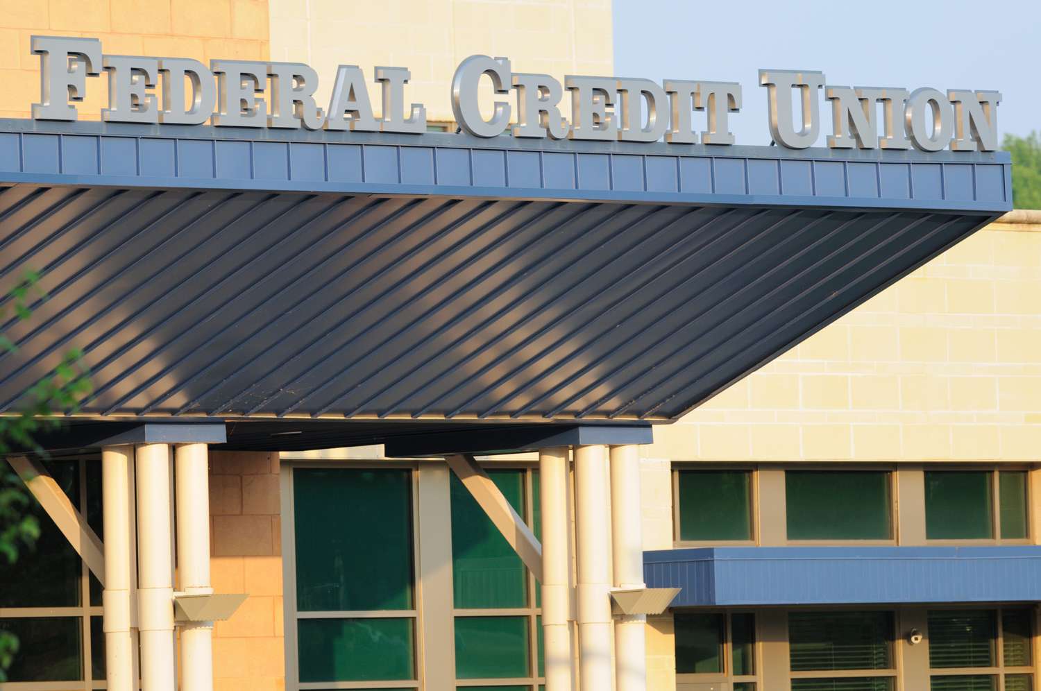 A photo of the front of a credit union, with the words "Federal Credit Union."