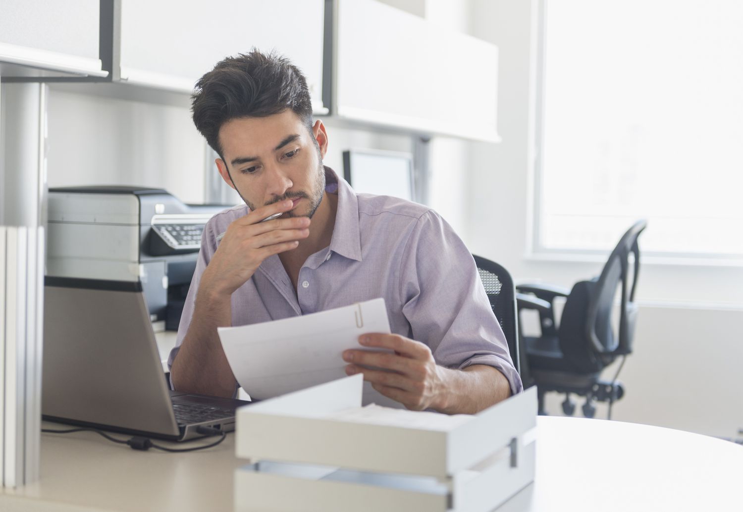 A man reviews a loan application.