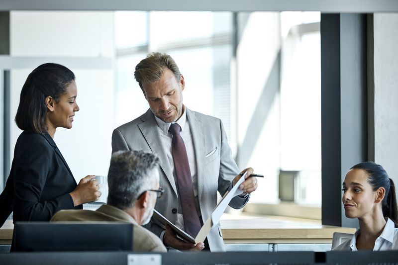 Corporate executives conduct a meeting.
