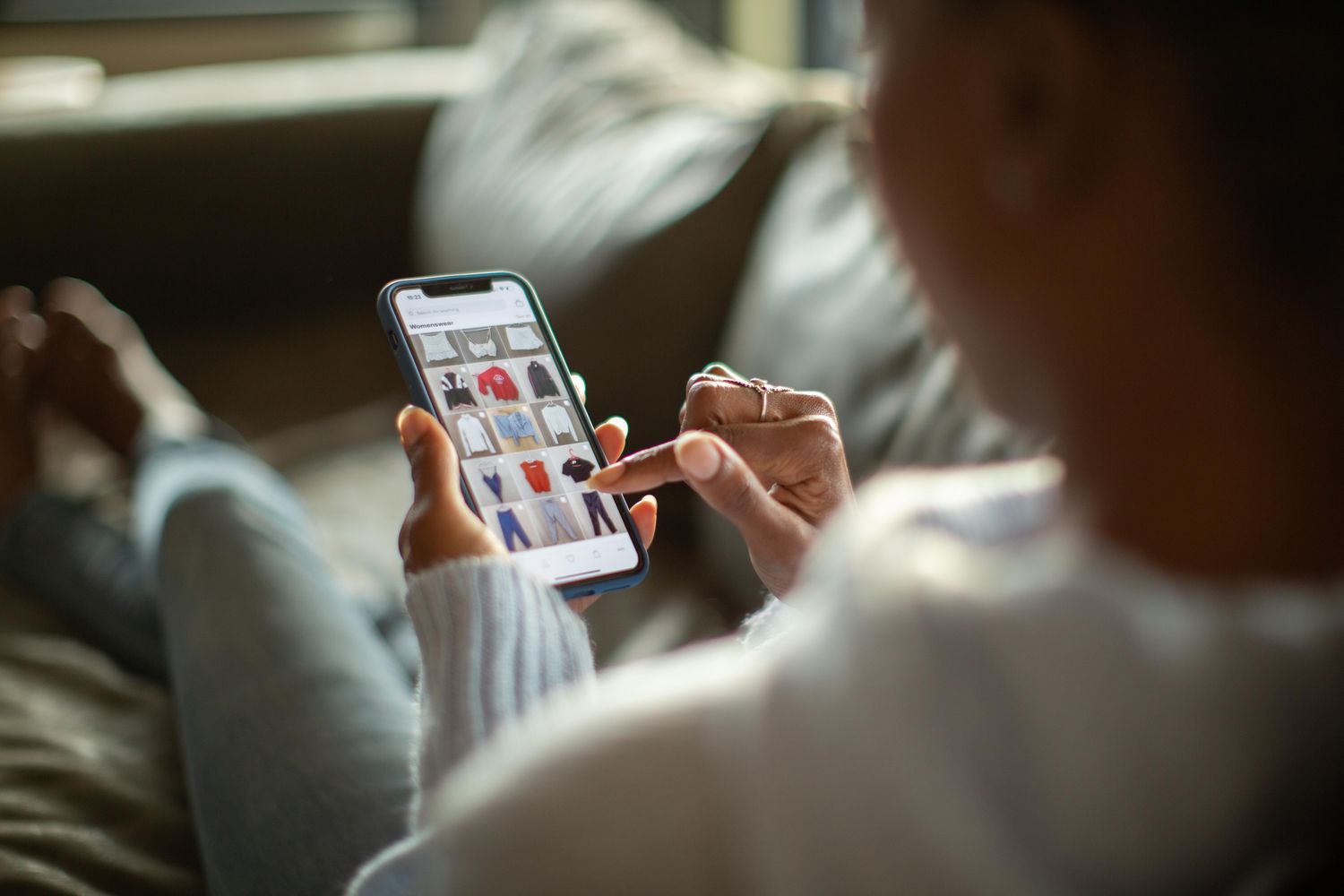 Shopper buying clothing on a smartphone