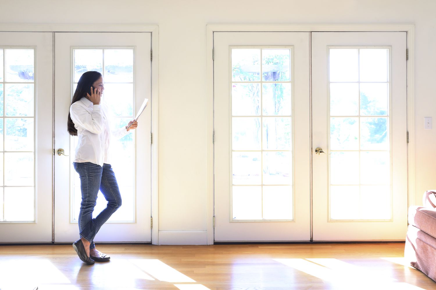 Woman touring a house she's planning to buy after recently recovering from bankruptcy