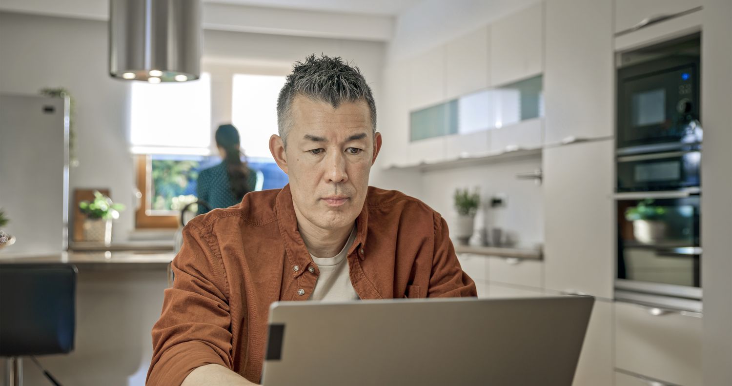 Man using laptop at home