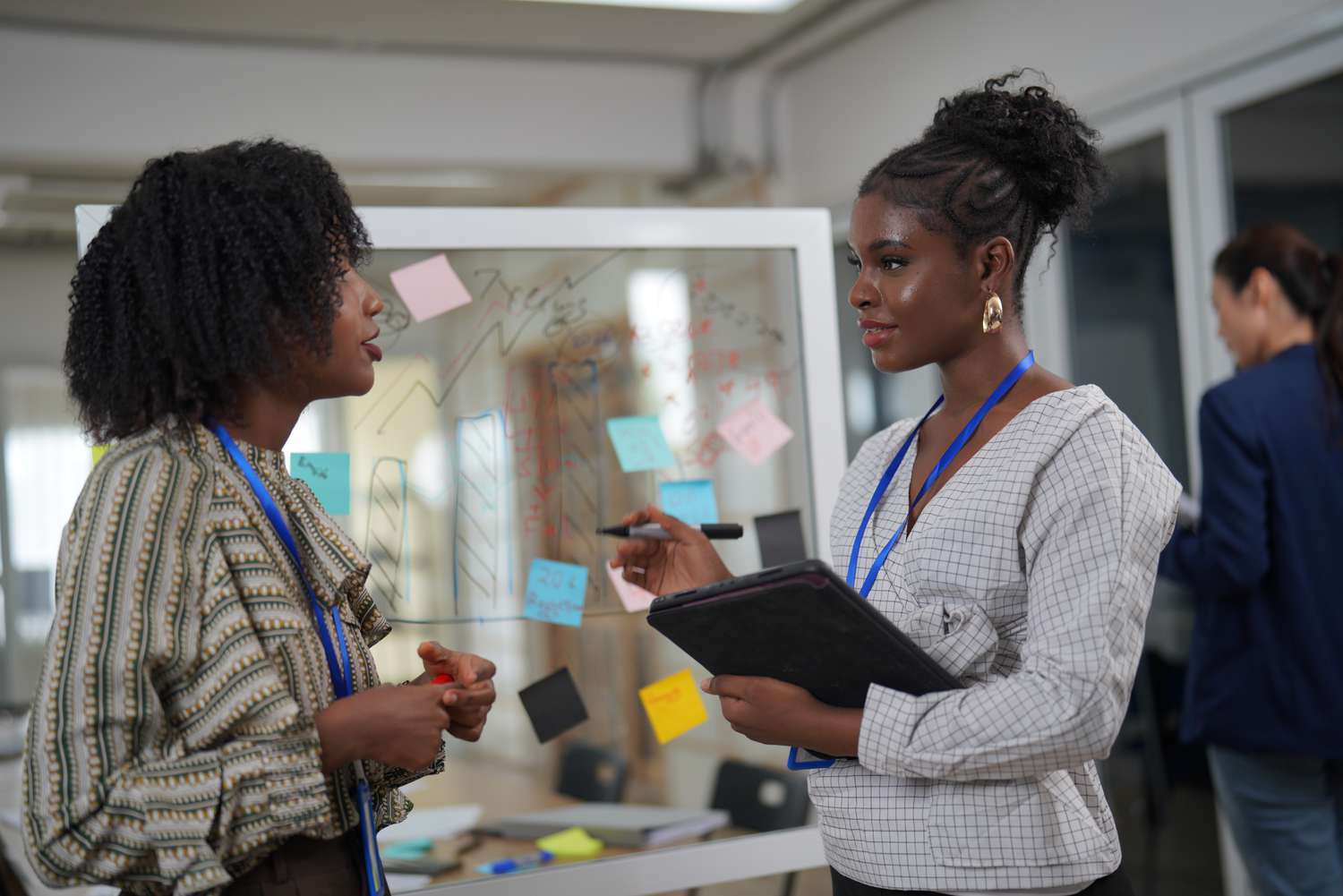 Two women talking in an office