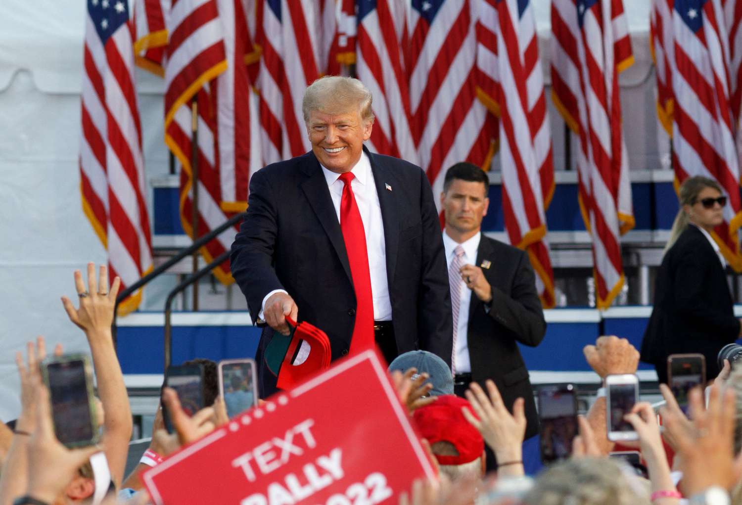 Former US President Donald Trump arrives for his campaign-style rally in Wellington, Ohio.