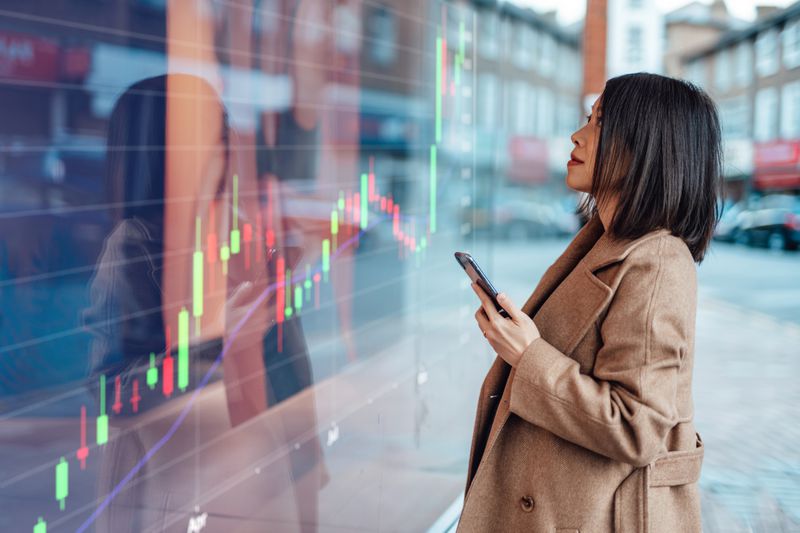 Woman looking at a chart in window