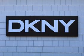 A DKNY sign hangs in front of their store at the Woodbury Common Premium Outlets shopping mall in Central Valley, New York