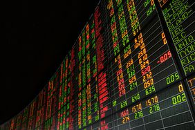 stock market numbers on a board