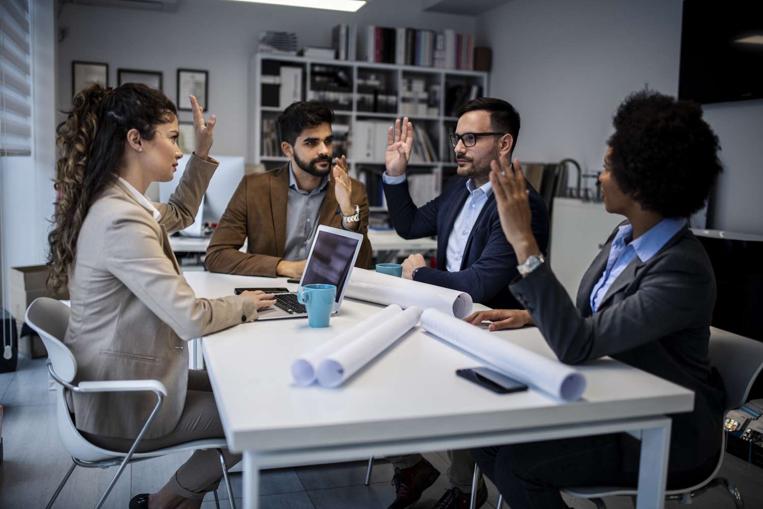 Four co-owners of a small business vote to change end of the company's fiscal year during a meeting.