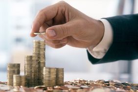 Businessman Is Stacking Coins