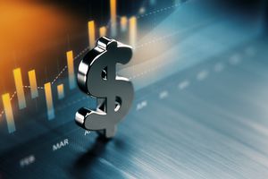 American dollar graph standing in front of a graph