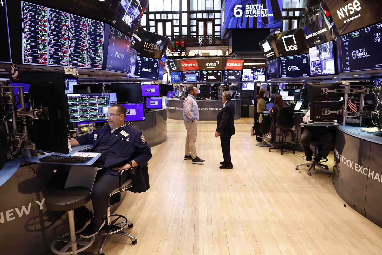 Traders work on the floor of the New York Stock Exchange.