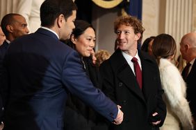 Mark Zuckerberg shakes hands with Marco Rubio.