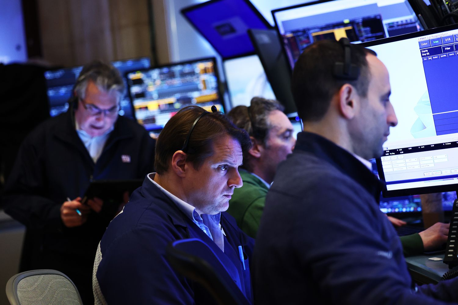 Traders work on the floor of the New York Stock Exchange