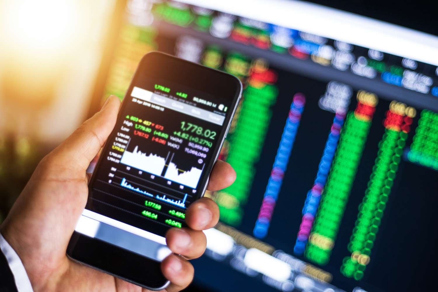 A businessman making trading online on the smart phone.