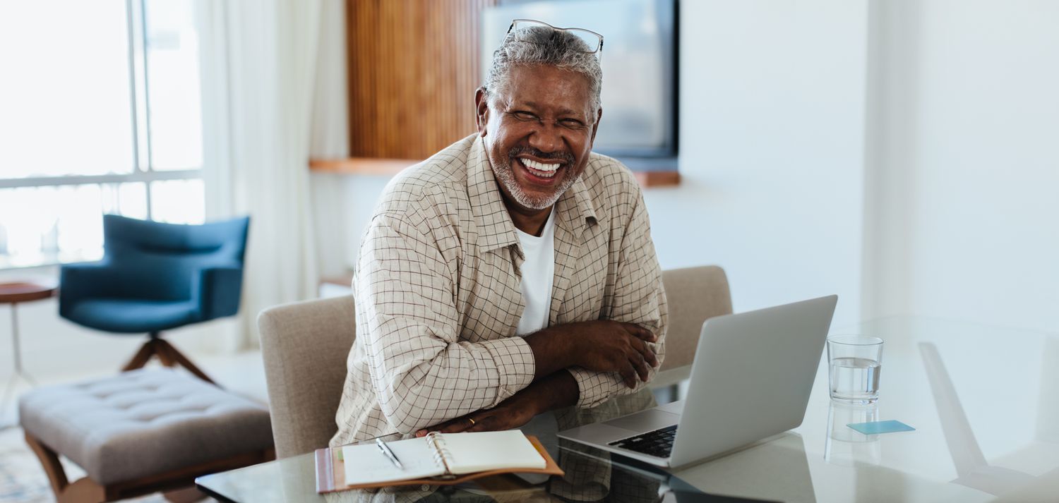 Businessman with a laptop and notebook
