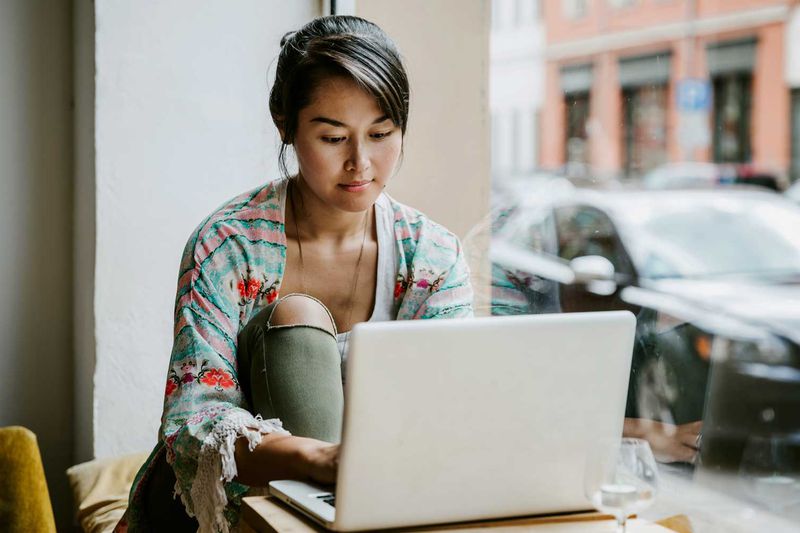 Woman sitting in front of a laptop computer