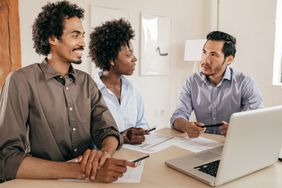 A couple reviews their options for short-term insurance coverage with their agent