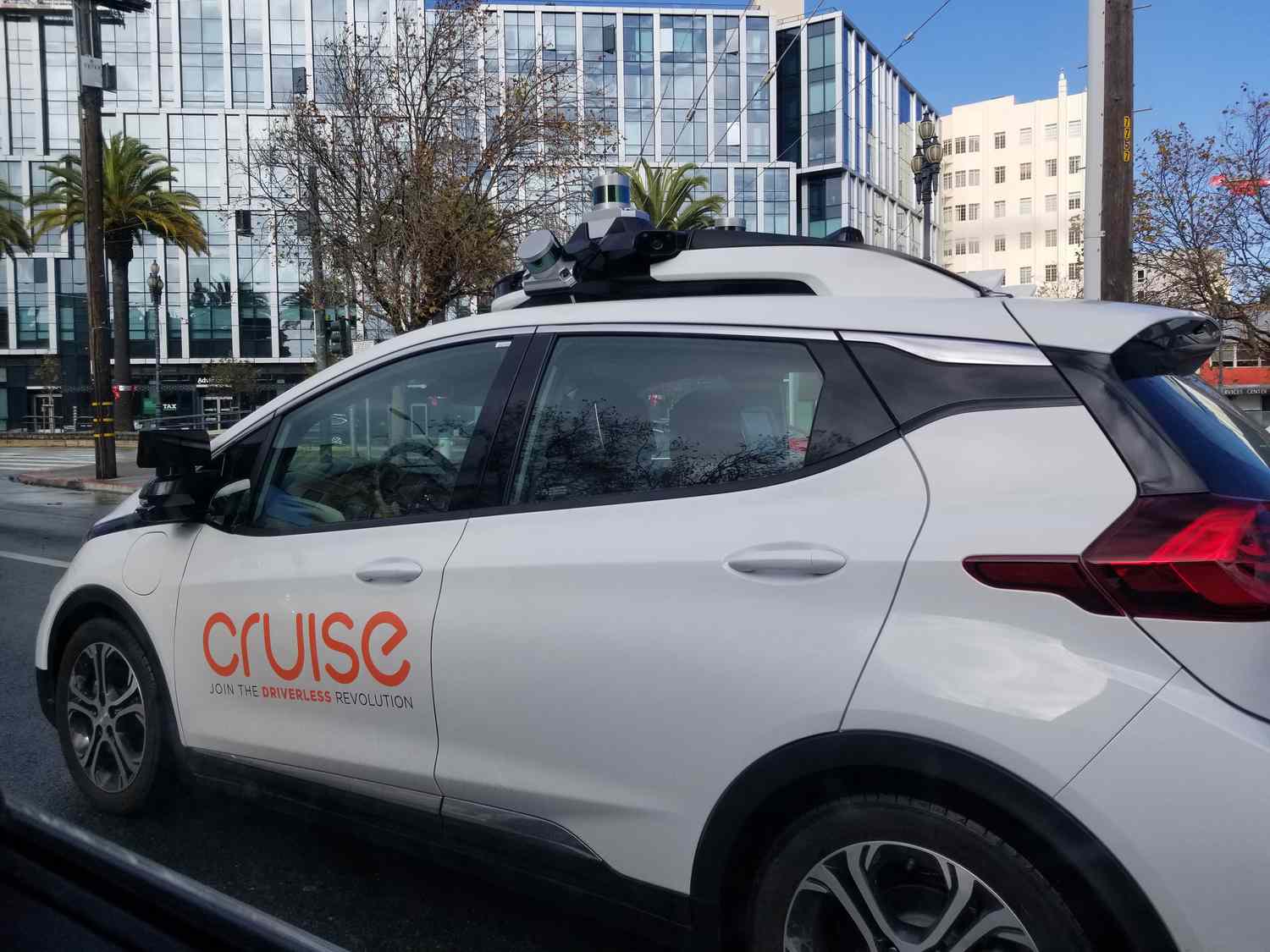 A GM Cruise driverless car operating on a city street in San Francisco.