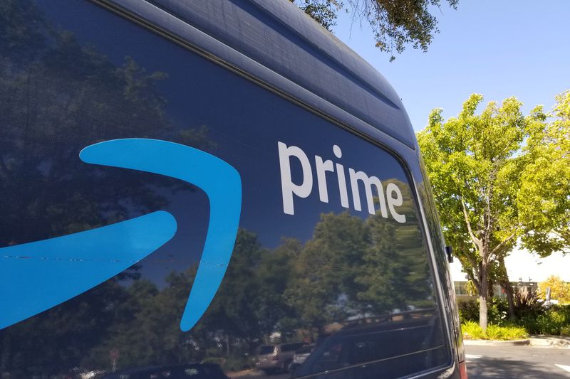 Close-up of logo for Amazon Prime service on a branded delivery truck.