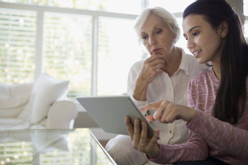 Two women looking at a tablet