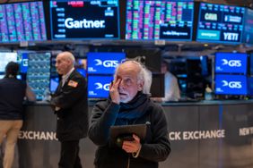 Traders work on the floor of the New York Stock Exchange.