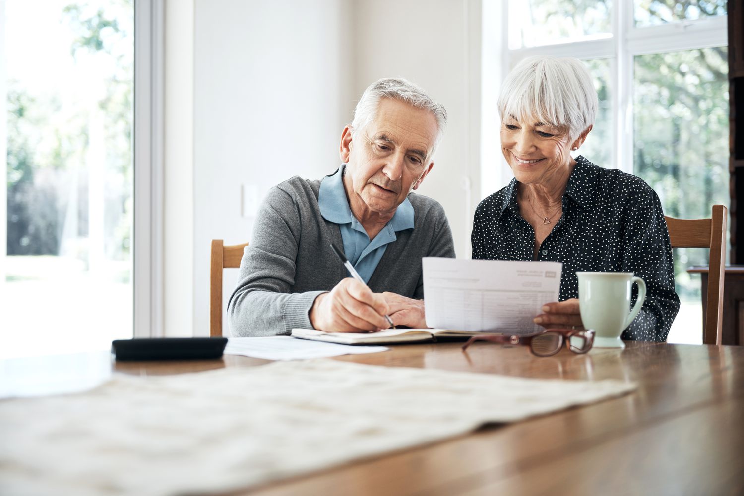 And older couple reviews debt documents.
