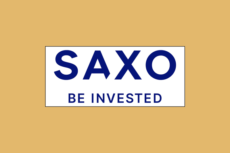 Image shows Saxo's logo in a white box against a mustard-colored background.