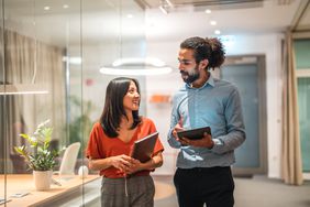 Colleagues talking in an office