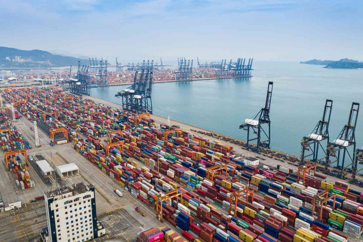 Aerial view of a container port with hundreds of containers