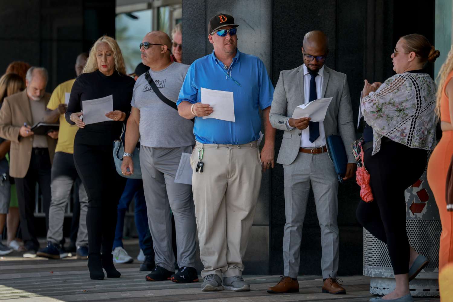  People line up as they wait for the JobNewsUSA.com South Florida Job Fair to open at the Amerant Bank Arena on June 26, 2024, in Sunrise, Florida