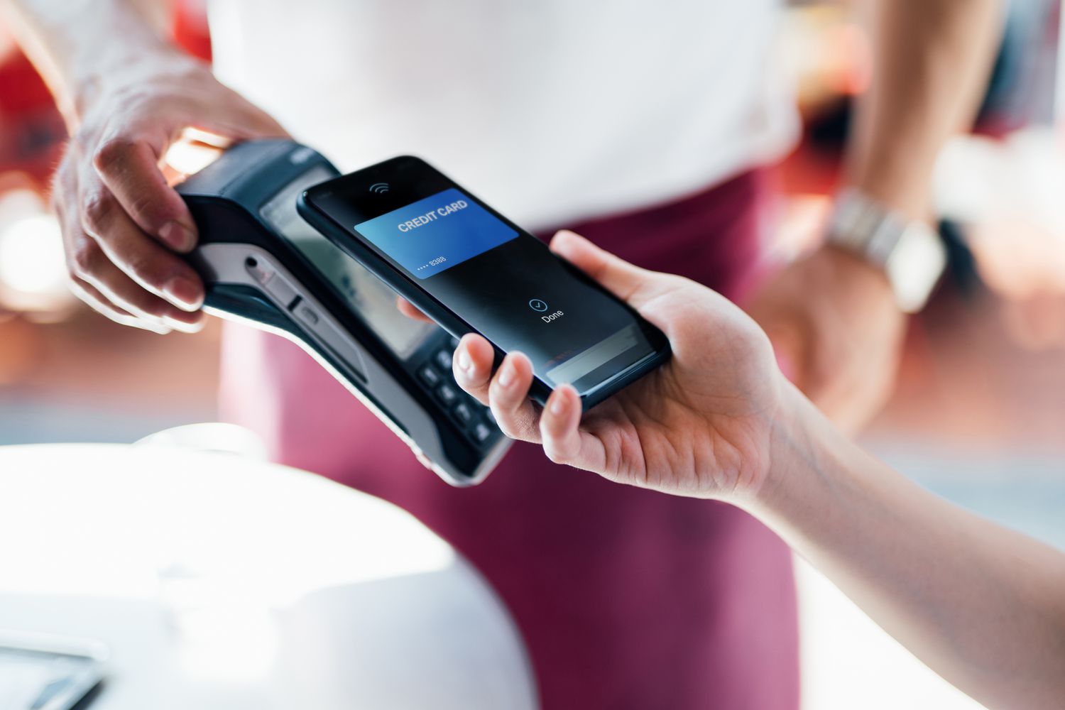Paying with a mobile phone on a card reader.