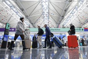 Travelers walk through O'Hare International Airport in Chicago in November. 