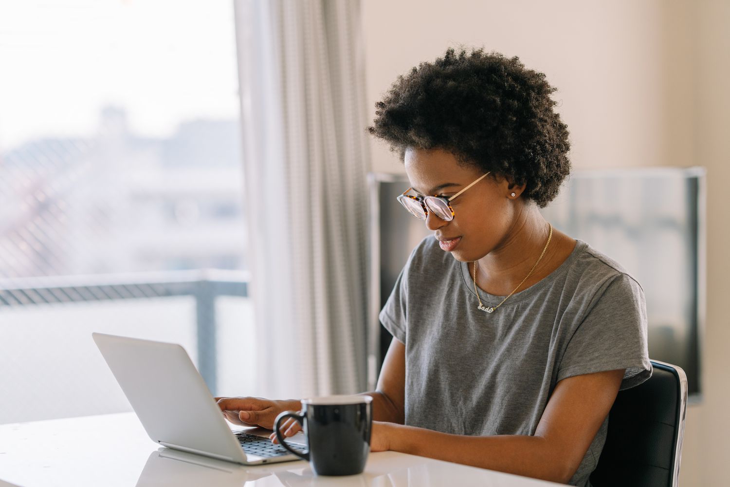 A college student looks over her loan options for the upcoming school year.