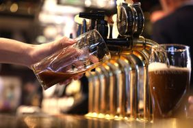A bar worker pours a Guinness in London in November. 