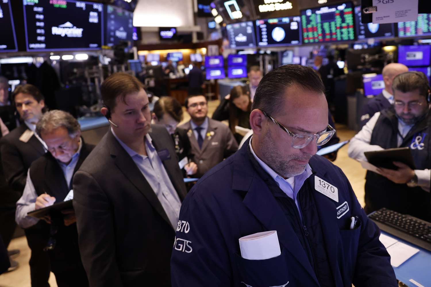 Traders work on the floor of the New York Stock Exchange.