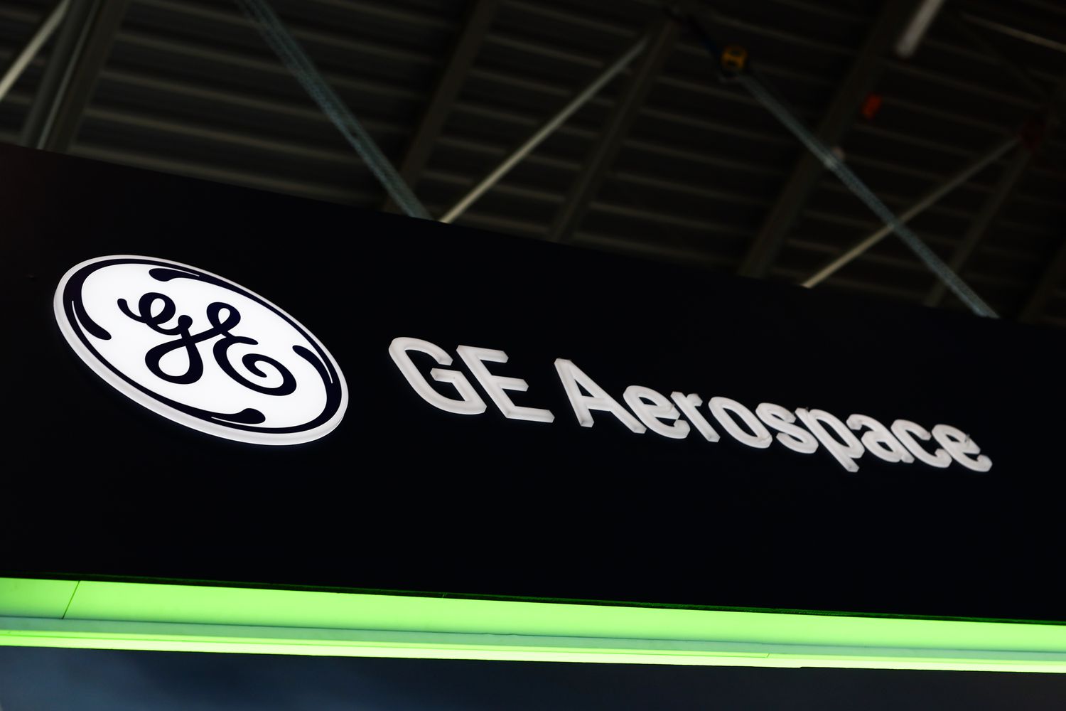 The GE logo is seen with "GE Aerospace" to the right, on a black background and a green light underneath