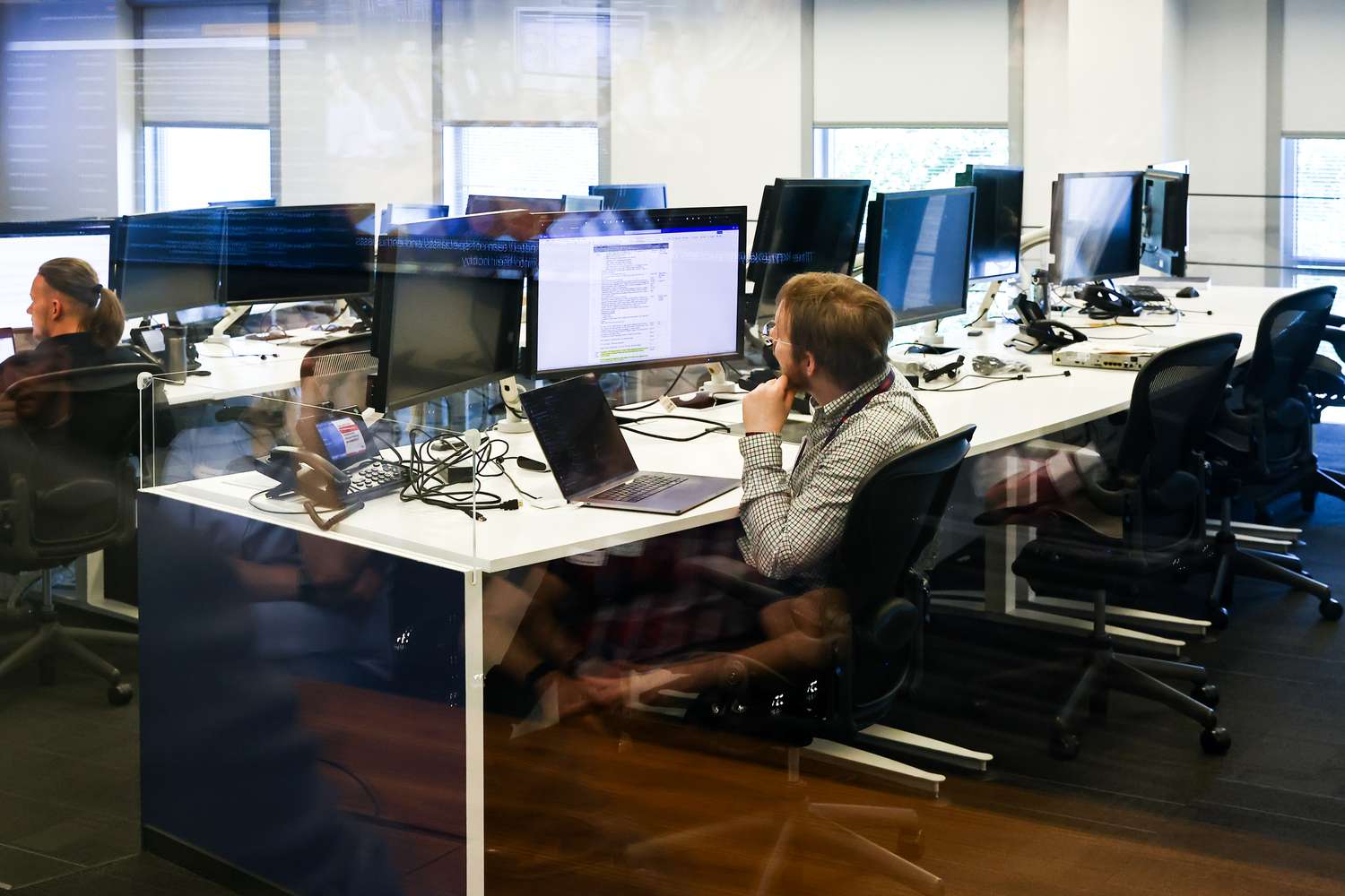 Man works on computer at an office desk