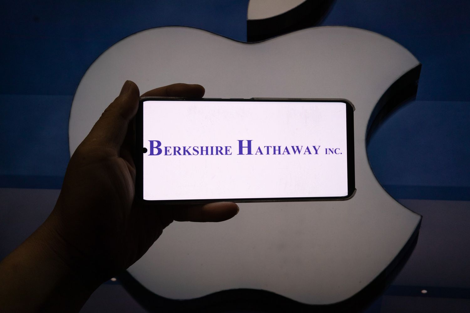 Photo taken on August 5, 2024 shows the logos of Warren Buffett's Berkshire Hathaway Inc and Apple Inc in Shanghai, China