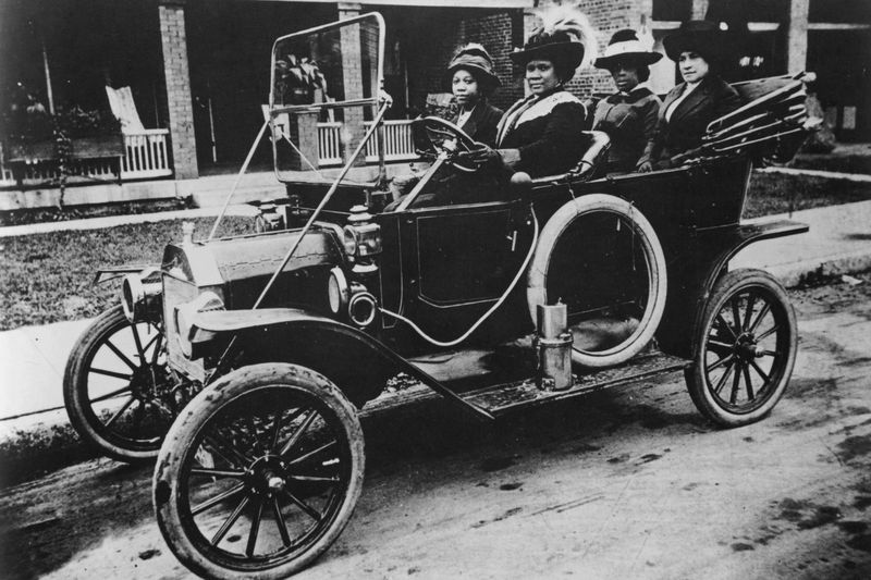 Madam C.J. Walker, the first woman to become a self-made millionaire in the United States, driving a car