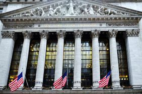 A wall of windows behind the colonnade provides ample natural light to the NYSE trading floor