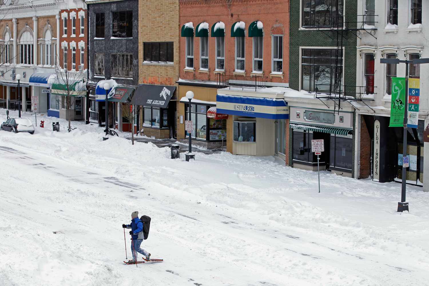 A man uses snow shoes to move through the downtown area near the University of Iowa as a major winter storm moves through the Midwest February 2, 2011 in Iowa City, Iowa.