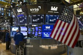 Traders work on the floor of the New York Stock Exchange