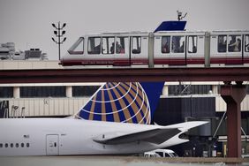 Passengers ride the air train at Newark Liberty International Airport in Newark, New Jersey on May 7, 2025