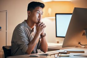 Man looks at computer wondering if Trump's proposed changes to PSLF could affect his forgiveness