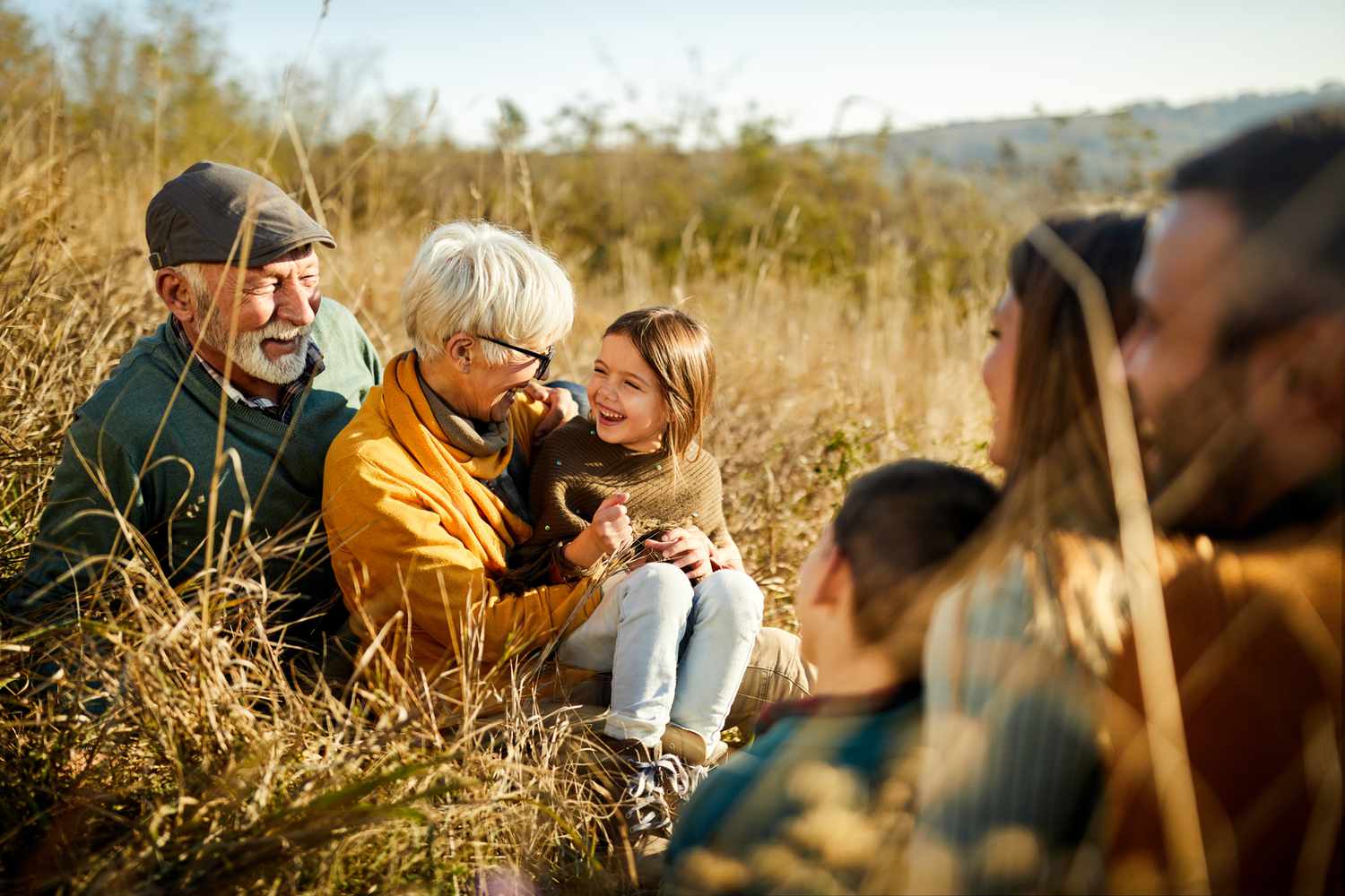 Multi-generational family in a field