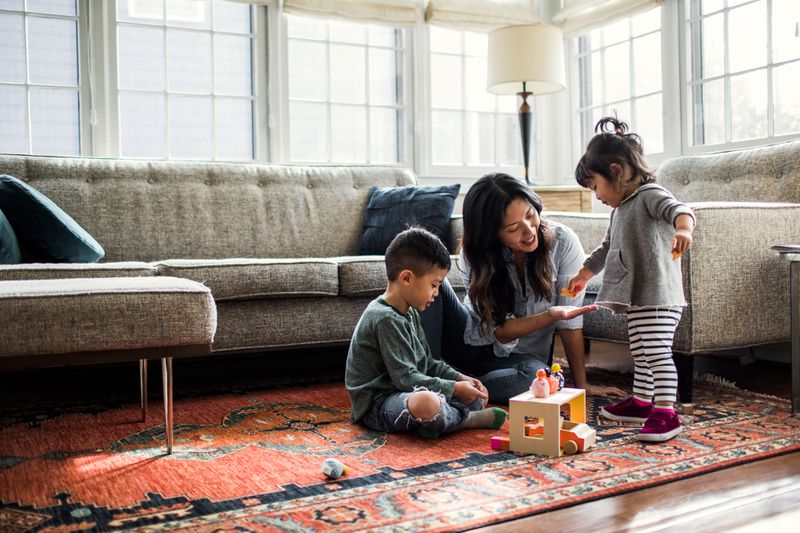 A family relaxes in a living room.