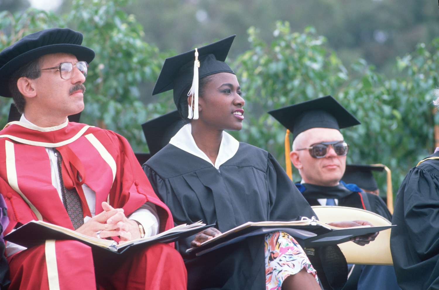 Culturally diverse faculty in formal robes at a graduation, UCLA, Los Angeles, CA 