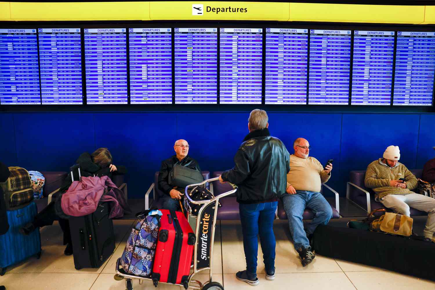 Passenger looking at flight board
