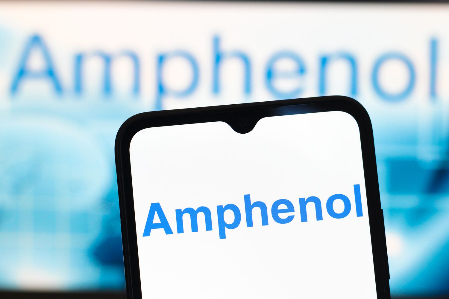 The Amphenol Corporation logo is seen displayed on a smartphone screen